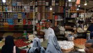 Yemenis shop in a market in the old city of Yemeni capital Sanaa, as the faithful prepare for the start of the Muslim holy fasting month of Ramadan, on May 25, 2017. AFP / Mohammed Huwais