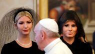 Pope Francis (C) walks past US First Lady Melania Trump (R) and the daughter of US President Donald Trump Ivanka Trump (L) at the end of a private audience at the Vatican on May 24, 2017. AFP / POOL / Alessandra Tarantino