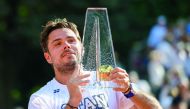 Stan Wawrinka  of Switzerland raises the trophy after winning the Geneva Open ATP 250 Tennis tournament, in Geneva, yesterday.