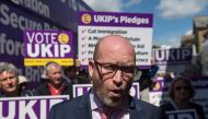 This file photo taken on May 20, 2017 shows UK Independence Party (UKIP) leader Paul Nuttall speaking to supporters as he campaigns with the party's candidate for the Clacton constituency, Peter Oakley (unseen), in Clacton-on-Sea, eastern England, on May 