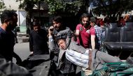 Men move an injured man to a hospital after a blast in Kabul, Afghanistan May 31, 2017. REUTERS/Mohammad Ismail