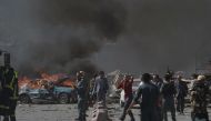 Afghan security forces personnel are seen at the site of a car bomb attack in Kabul on May 31, 2017. At least 40 people were killed or wounded on May 31 as a massive blast ripped through Kabul's diplomatic quarter, shattering the morning rush hour and bri