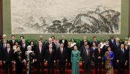 FILE PHOTO: Chinese President Xi Jinping poses for a group photo with other delegates and guests at the welcoming banquet for the Belt and Road Forum in Beijing on May 14, 2017 (AFP / Jason Lee) 