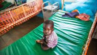 REPRESENTATIVE IMAGE: A malnourished child sits on May 30, 2017, on a bed at the clinic run by Doctors Without Borders (MSF) in Aweil, Northern Bahr al Ghazal, South Sudan. AFP / Albert Gonzalez Farran