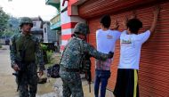 A government soldier frisks a resident who evacuated his home in Sarimanok village, Marawi City, Philippines June 1, 2017, during an ongoing assault of government troops on insurgents from the Maute group, who have taken over large parts of the city. Reut