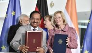 Minister for Science and Technology and Earth Science, Harsh Vardhan (Front L) and German Education and Research Minister, Johanna Wanka hold documents after they signed contracts as Indian Prime Minister Narendra Modi (Back L) and German Chancellor Angel