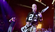 (FILES) This file photo taken on April 05, 2015 shows singer Serj Tankian (L) and musician Shavo Odadjian of System of a Down performing at The Forum in Inglewood, California.  AFP 