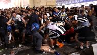 Football Soccer - Juventus v Real Madrid - UEFA Champions League Final - San Carlo Square, Turin, Italy - June 3, 2017 Juventus' fans run away from San Carlo Square following panic created by the explosion of firecrackers as they was watching the match on
