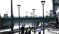 Police officers stand at a cordon near Blackfriars Bridge on the South Bank of the Thames after an attack on London Bridge and Borough Market left 6 people dead and dozens injured in London, Britain, June 4, 2017. REUTERS/Dylan Martinez.