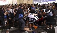 Football Soccer - Juventus v Real Madrid - UEFA Champions League Final - San Carlo Square, Turin, Italy - June 3, 2017 Juventus' fans run away from San Carlo Square following panic created by the explosion of firecrackers as they was watching the match on