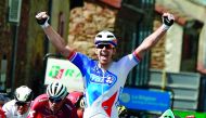France's Arnaud Demare celebrates as he crosses the finish line at the end of the 171km second stage of the 69th edition of the Criterium du Dauphine cycling race yesterday. 