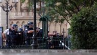 French policemen point their weapons near the site of an attack at the entrance of Notre-Dame cathedral in Paris on June 6, 2017. AFP / Karim DAHER