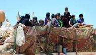 Syrians, who fled the IS stronghold of Raqqa, arrive in an area near the village of Balaban, south of Jarablus, yesterday.