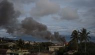Smoke rises after aerial bombings by Philippine Air Force planes on Islamist militant positions in Marawi, on the southern Philippine island of Mindanao on June 9, 2017. AFP / NOEL CELIS
