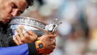  Spain's Rafael Nadal celebrates with the trophy after winning the final against Switzerland's Stan Wawrinka. (Reuters / Christian Hartmann)