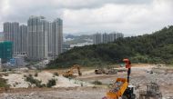 A truck unloads garbage at a landfill at Tseung Kwan O district in Hong Kong, China June 9, 2017. REUTERS/Tyrone Siu