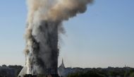 Smoke billows as firefighters deal with a serious fire in a tower block at Latimer Road in West London, Britain June 14, 2017. REUTERS/Toby Melville
