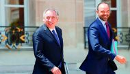 French Prime Minister Edouard Philippe (right) and French Minister of Justice Francois Bayrou leave a cabinet meeting at the Elysee Palace, in Paris, yesterday. 