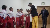 Former NBA star Dennis Rodman (R) of the US greets North Korean athletes at the Pyongyang Indoor Stadium on June 15, 2017 Rodman arrived in the North Korean capital on June 13 on a mission he said he believed the US President would be 