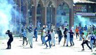 Protesters clash with Indian government forces in downtown Srinagar, yesterday. 