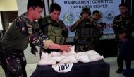 Government forces display 11kg worth 110 to 250 million pesos ($2.2 to 5 million USD) of high grade Methamphetamine Hydrochloride 