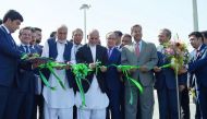Afghan President Ashraf Ghani cutting a ribbon at the opening ceremony for the first Afghan-India air corridor in Kabul, yesterday.