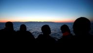 Migrants look at south Italy's coast as they approach on the Vos Hestia ship after being rescued by 'Save the Children' crew on the Mediterranean sea off the Libya coast, June 20, 2017. — Reuters pic.