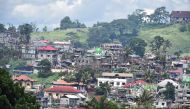 A bird's eye view of destroyed houses after one month of fighting between government troops in Marawi on June 24, 2017. AFP / PA / TED ALJIBE
