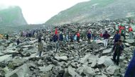 Chinese military police and rescue workers at the site of a landslide in Xinmo village, Sichuan province, yesterday.