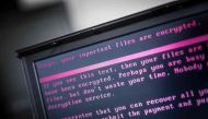A laptop displays a message after being infected by a ransomware as part of a worldwide cyberattack on June 27, 2017 in Geldrop. Netherlands OUT / AFP / ANP / Rob Engelaar