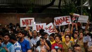 Indian protesters hold placards as they gather during a 'Not in my name' silent protest at Jantar Mantar in New Delhi on June 28, 2017, following a spate anti-Muslim killings. AFP / Chandan Khanna