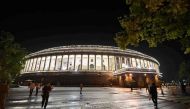 View of the Indian Parliament illuminated prior to a special session for the implementation of the new Goods and Services Tax (GST) regime in New Delhi on June 30, 2017. AFP / PRAKASH SINGH