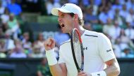 Britain's Andy Murray reacts after breaking Germany's Dustin Brown's serve during their men's singles second round match on the third day of the 2017 Wimbledon Championships at The All England Lawn Tennis Club in Wimbledon, yesterday. 