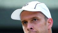 Luxembourg's Gilles Muller celebrates after scoring against Spain's Rafael Nadal during their men's singles fourth round match of the 2017 Wimbledon Championships in London yesterday. Muller won 6-3, 6-4, 3-6, 4-6, 15-13.