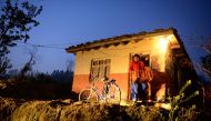 In this photograph taken on February 2, 2017 vegetable vendor Nandukula Basnet, 33, prepares to leave in the early morning for the market in Birendranagar, some 520km west of Kathmandu (AFP / Prakash Mathema) 