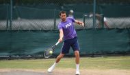 Croatia's Marin Cilic hits a shot as he attends a practice session at The All England Lawn Tennis Club in Wimbledon, southwest London, on July 13, 2017 on the tenth day of the 2017 Wimbledon Championships, on the eve of his semi-final match against US pla