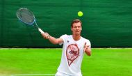 Czech Republic's Tomas Berdych plays a shot as he attends a practice session yesterday, on the eve of his Wimbledon semi-final match against Switzerland's Roger Federer in London.