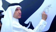 Qatar Airways Group Chief Executive Akbar Al Baker signing on 'Tamim Al Majd' banner, at Qatar Airways Tower 2 in Doha, yesterday. Pic: Baher Amin / The Peninsula