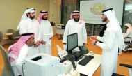 Officials receiving complaints from people at the Compensation Claims Committee headquarters at Doha Exhibition and Convention Center.