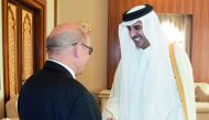 Emir H H Sheikh Tamim bin Hamad Al Thani with French Minister for Europe and Foreign Affairs Jean-Yves Le Drian at Al Bahr Palace yesterday. 