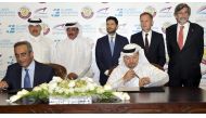 The New Port Project Executive Director, Maisar Jamil El Qutami (third right) and CEO of the Al Jaber Engineering, Osama Hadid ( left) at the signing ceremony, in the presence of the Minister of Transport and Communications, Jassim Saif Ahmed Al Sulaiti, 