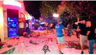 People stand outside damaged buildings after an earthquake in the Greek island of Kos, yesterday.