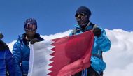 The Qatari flag being hoisted atop Mt Elbrus, the highest mountain in Europe.