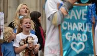 Supporters of the terminally-ill British baby Charlie Gard react after the announcement that his parents have abandoned their legal fight to take their son to the US for experimental treatment at the Royal Courts of Justice in London on July 24, 2017. (AF