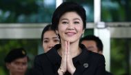 Ousted former Thai prime minister Yingluck Shinawatra gestures in a traditional greeting as she leaves the Supreme Court in Bangkok, Thailand, July 21, 2017. Reuters/Athit Perawongmetha