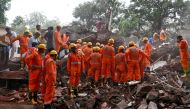 Rescue workers search for survivors at the site of a collapsed building in the suburbs of Mumbai, India July 25, 2017. REUTERS/Danish Siddiqui
