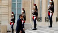 French President Emmanuel Macron walks after a meeting at the Elysee Palace in Paris, France, July 28, 2017. REUTERS/Philippe Wojazer