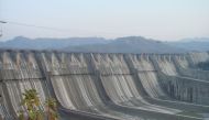 The Sardar Sarovar Dam, undergoing height increase in 2006. Wikimedia Commons / AceFighter19 
