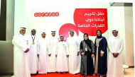 Ooredoo Chairman Sheikh Abdulla bin Mohammed Al Thani and other officials with athletes at the event.