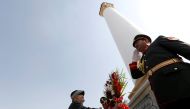 Afghan President Ashraf Ghani (L) places a wreath of flowers next to the minaret of liberty during Afghan Independence Day celebrations in Kabul, Afghanistan August 19, 2017. REUTERS/Mohammad Ismail
